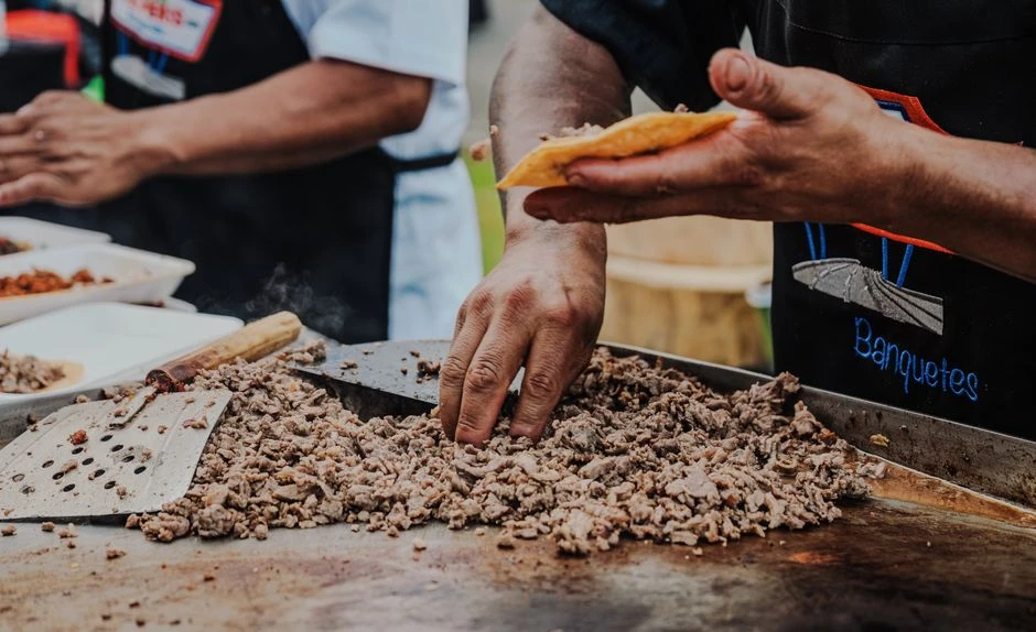 Street food taco stand with tacos al pastor trompo in Mexico City