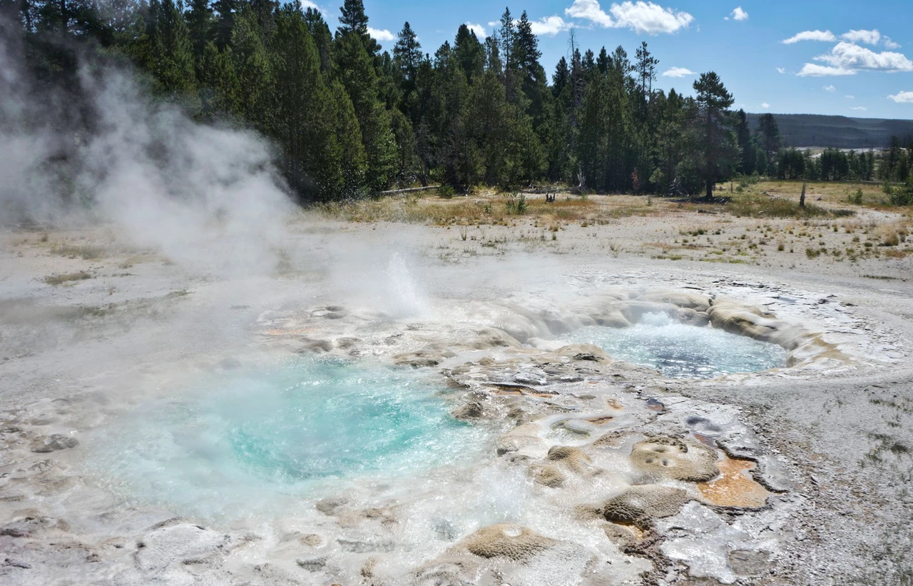 Steam rising from a geyser basin in Yellowstone National Park near Big Sky, Montana
