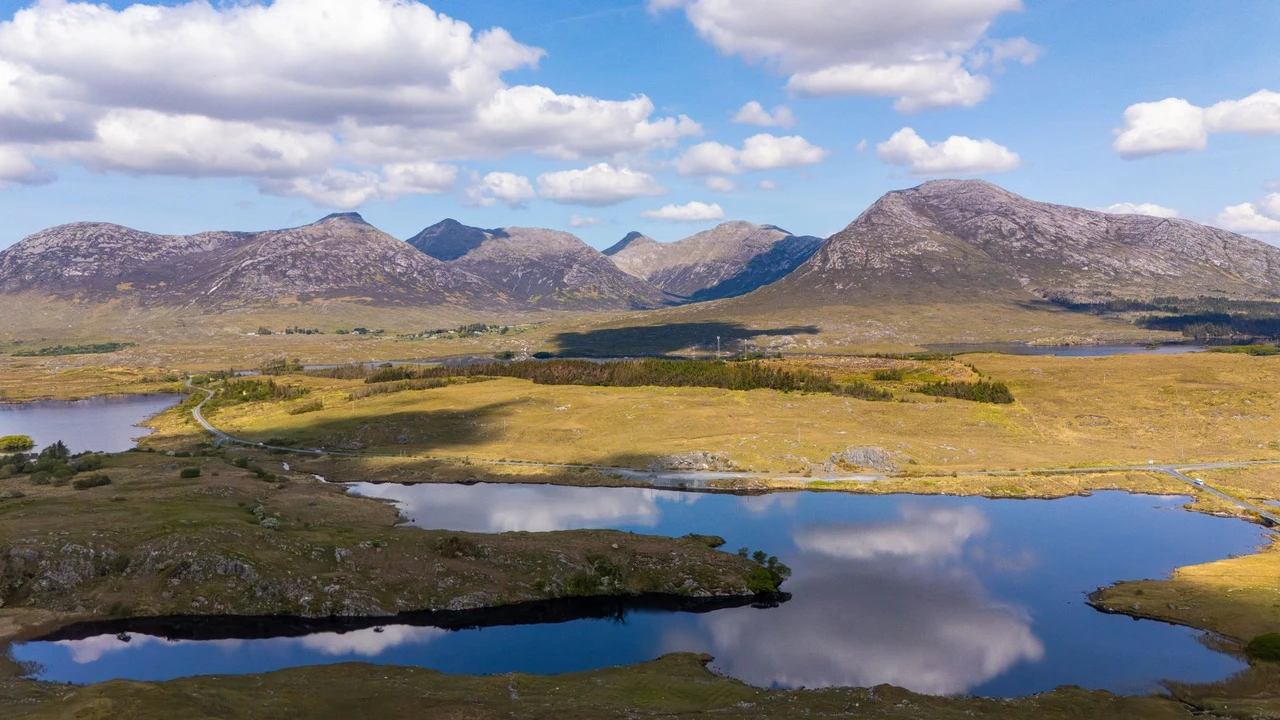 Aerial view of Connemara's mountains and lakes reflecting the Irish countryside